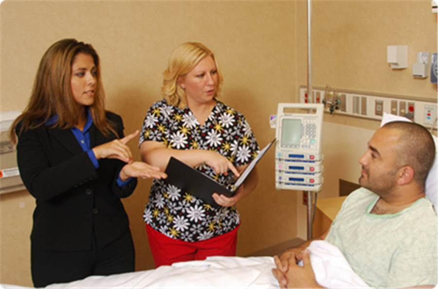 A woman interpreting at a doctors appointment.
